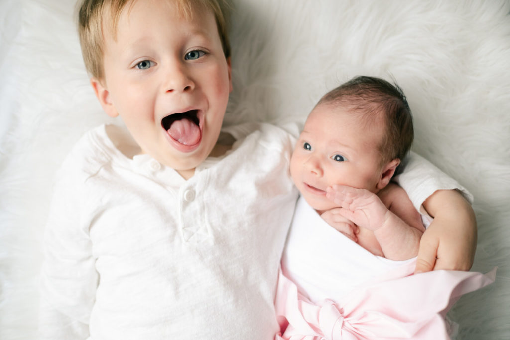 Naperville Newborn Photographer, big brother holding baby sister