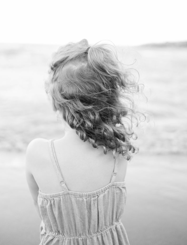 a portrait of a young girl's curls.